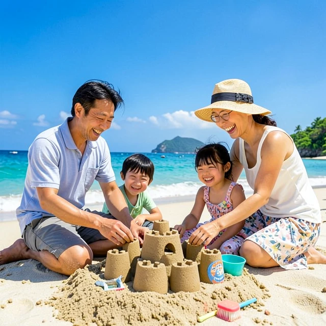 沖縄のビーチで家族が砂遊びを楽しむ様子